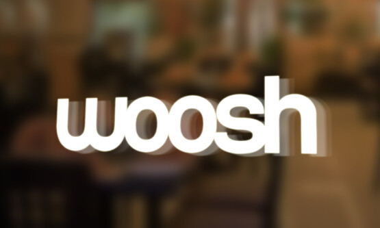 woosh logo on glass